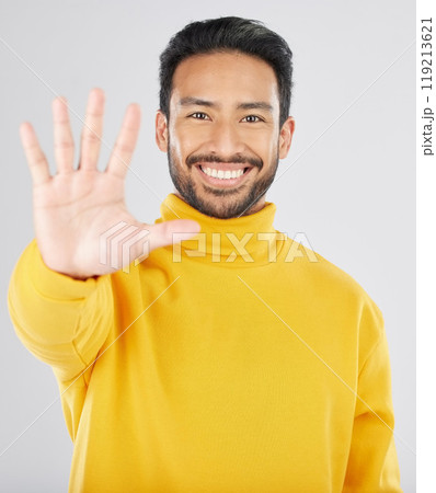 Man, palm and stop in studio portrait, smile and emoji for opinion, rejection or no by white background. Young Indian guy, student or fashion model with hand, sign language or show gesture for review Man, palm and stop in studio portrait, smile and emoji for opinion, rejection or no by white background. Young Indian guy, student or fashion model with hand, sign language or show gesture for review 119213621