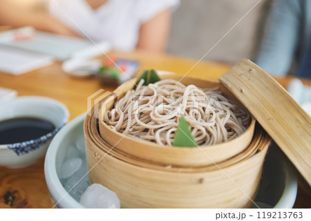 Restaurant, bamboo and closeup of a bowl of noodles for authentic Asian cuisine for diet. Food, steamer pot and zoom of Japanese ramen for a nutrition meal for dinner, lunch or supper at a diner. Restaurant, bamboo and closeup of a bowl of noodles for authentic Asian cuisine for diet. Food, steamer pot and zoom of Japanese ramen for a nutrition meal for dinner, lunch or supper at a diner. 119213763