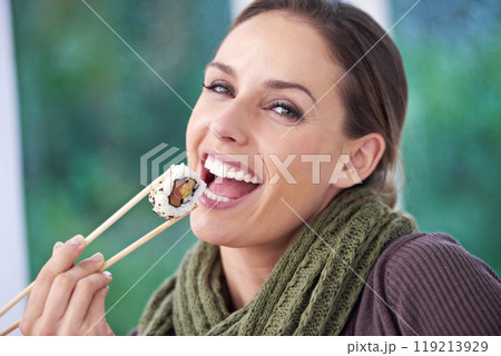 Happy woman, eating sushi and healthy food in portrait, lunch or dinner, Japanese cuisine and seafood with chopsticks. Catering, hungry and diet, relax with meal at home and dish for nutrition 119213929