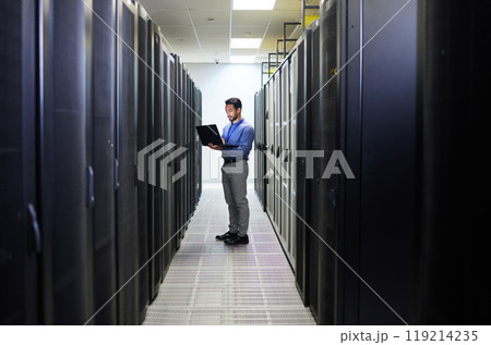 Server room, laptop or man typing for cybersecurity glitch, machine or to search online for servers system. IT support, data center or engineer fixing network for information technology solution Server room, laptop or man typing for cybersecurity glitch, machine or to search online for servers system. IT support, data center or engineer fixing network for information technology solution 119214235