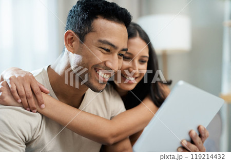 Hug, happy and couple with tablet on sofa relax with social media, movies or streaming film at home. Love, smile and people in living room with digital, search or app for show, video or communication Hug, happy and couple with tablet on sofa relax with social media, movies or streaming film at home. Love, smile and people in living room with digital, search or app for show, video or communication 119214432