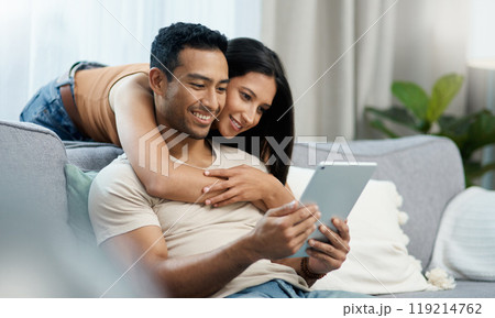 Happy, hug and couple with tablet on sofa relax with social media, movies or streaming film at home. Love, smile and people in living room with digital, search or app for show, video or communication Happy, hug and couple with tablet on sofa relax with social media, movies or streaming film at home. Love, smile and people in living room with digital, search or app for show, video or communication 119214762