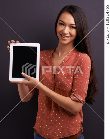 Woman, studio and tablet with mockup, screen and technology for communication and connectivity. Model, tech and confidence with smile, happiness and space for online app or social media connection 119214765