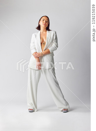 Fashion, confidence and portrait of woman with suit for classy, sexy and fancy style in studio. Luxury, beautiful and full body of Asian female model with elegant outfit isolated by white background. 119215039