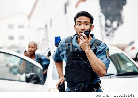 Asian man, police and walkie talkie for suspect in city communication, reinforcement or emergency. Serious male person, security guard or cop radio calling backup for crime in street of an urban town Asian man, police and walkie talkie for suspect in city communication, reinforcement or emergency. Serious male person, security guard or cop radio calling backup for crime in street of an urban town 119215148