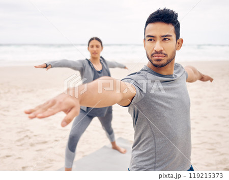People, yoga and warrior pose on beach for fitness, exercise and holistic wellness, teamwork or workout outdoor. Couple of friends or instructor stretching with balance, health and pilates by ocean 119215373