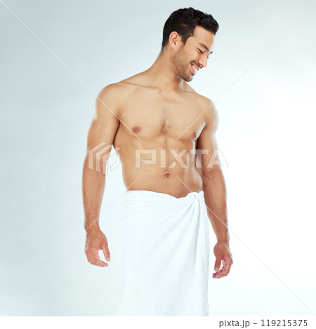Shower, towel and happy fitness man in studio for wellness, hygiene or body care routine on white background. Cleaning, grooming or muscular Japanese male model with pamper, cosmetics or treatment 119215375