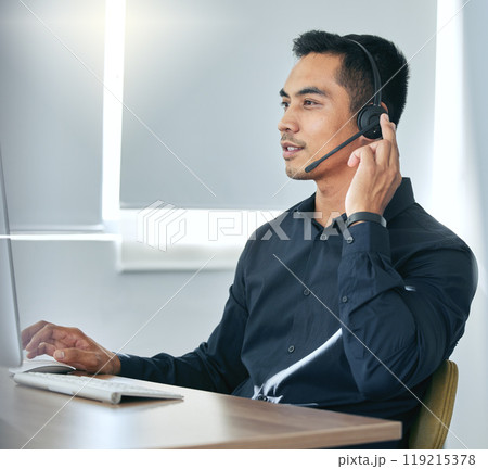 Callcenter, phone call and man in office for customer service, telemarketing sale in headset at help desk. Advisor, salesman or virtual assistant in client care, tech support or crm consulting agency 119215378