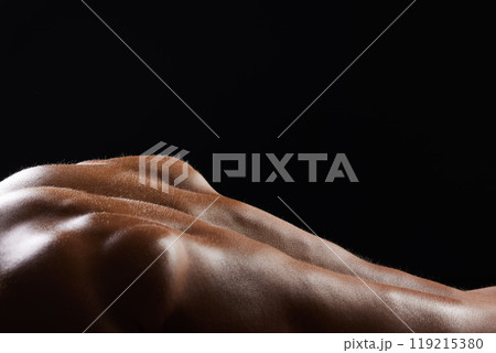 Back, sweat and athlete or skin of man in workout, exercise or body builder with strong, muscle in pushup for health. Dark, background and texture or anatomy of person with fitness from training 119215380