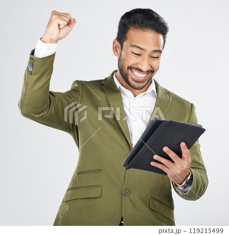 Business man, winner and success on tablet for stock market, trading news or results, profit and sales in studio. Excited professional person for digital trading with fist and yes on white background 119215499