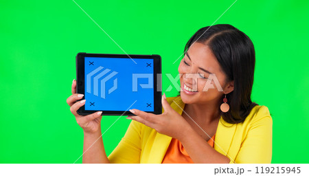 Woman, tablet or mockup with green screen or chroma key for advertising, news or promo on studio background. Happy Asian person, space or digital technology for social media announcement or marketing Woman, tablet or mockup with green screen or chroma key for advertising, news or promo on studio background. Happy Asian person, space or digital technology for social media announcement or marketing 119215945