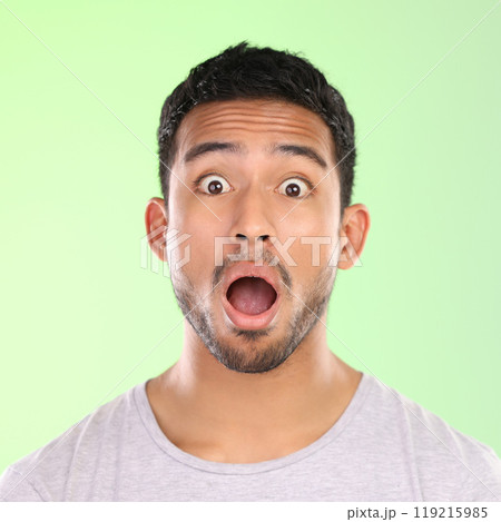 Wow, shock and portrait of man in studio with amazing news, announcement and mouth open. Surprise, omg and male person with emoji face for gossip, drama and speechless emotion on green background Wow, shock and portrait of man in studio with amazing news, announcement and mouth open. Surprise, omg and male person with emoji face for gossip, drama and speechless emotion on green background 119215985