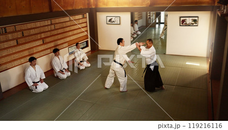 Japanese men, martial arts class or training in fight, modern or aikido to learn self defence. Sensei, black belt students and instruction in dojo place, sport and combat demonstration for discipline 119216116