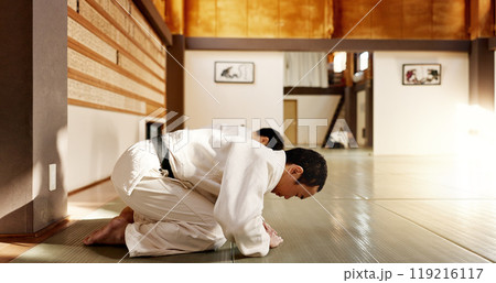 Japanese student, bow or men in dojo to start aikido practice, discipline or self defense education. Black belt master greeting, people learning respect or sensei ready in fighting class or training Japanese student, bow or men in dojo to start aikido practice, discipline or self defense education. Black belt master greeting, people learning respect or sensei ready in fighting class or training 119216117