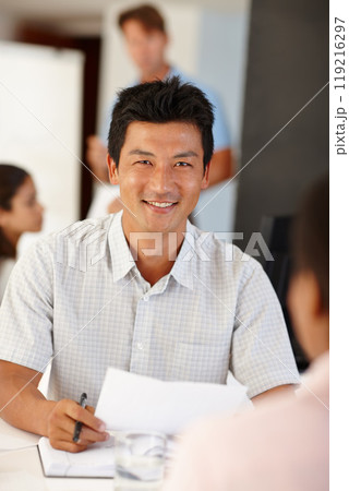 Documents, Asian man or business people in meeting for report, agenda discussion or portfolio for project. Smile, teamwork or workers planning in office talking, conversation or speaking of paperwork Documents, Asian man or business people in meeting for report, agenda discussion or portfolio for project. Smile, teamwork or workers planning in office talking, conversation or speaking of paperwork 119216297