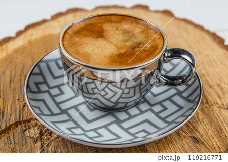 espresso cup on a wooden stand made of real oak espresso cup on a wooden stand made of real oak 119216771