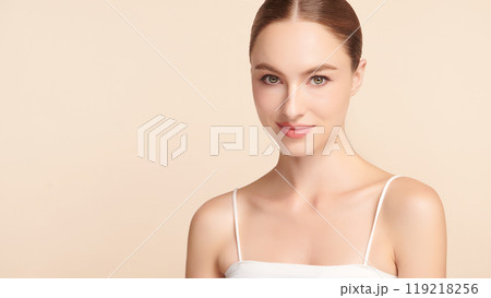 Beautiful young woman with clean fresh skin on beige background, Face care, Facial treatment, Cosmetology, beauty and spa, women portrait. 119218256