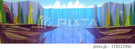 Suspension rope bridge in mountains with waterfall 119222992