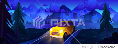 Yellow car driving night road in mountain valley 119223202