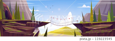Suspension rope bridge in mountains 119223545