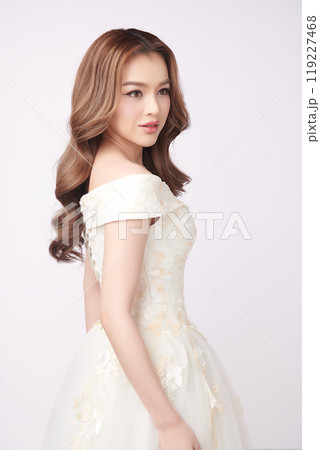 Beautiful young asian woman in wedding dress on white background, Beautiful young asian woman in wedding dress on white background, 119227468