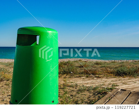 Empty beach with trash can 119227721
