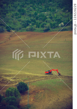 Digger excavator on field. Digger excavator on field. 119228229