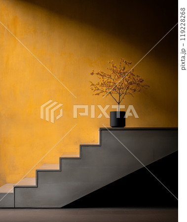 A minimalist staircase with a potted plant against a vibrant yellow wall in an indoor space 119228268