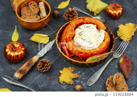 Pumpkin stuffed filled with camembert cheese. 119228884