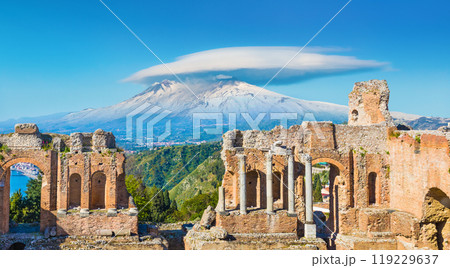 Ancient Greek theatre in Taormina on background of Etna Volcano, Sicily, Italy. 119229637