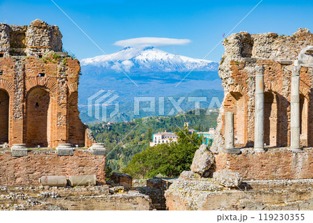 Ancient Greek theatre in Taormina on background of Etna Volcano, Italy Ancient Greek theatre in Taormina on background of Etna Volcano, Italy 119230355