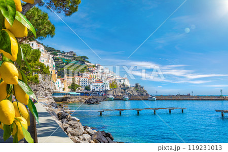 Beautiful Amalfi on hills leading down to coast, comfortable beaches and azure sea on Amalfi Coast in Campania, Italy Beautiful Amalfi on hills leading down to coast, comfortable beaches and azure sea on Amalfi Coast in Campania, Italy 119231013