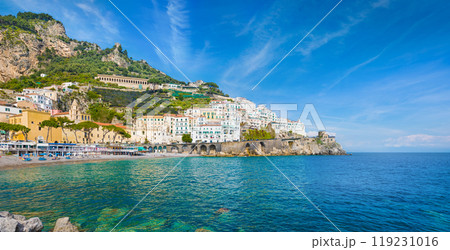Beautiful Amalfi on hills leading down to coast, comfortable beaches and azure sea on Amalfi Coast in Campania, Italy Beautiful Amalfi on hills leading down to coast, comfortable beaches and azure sea on Amalfi Coast in Campania, Italy 119231016