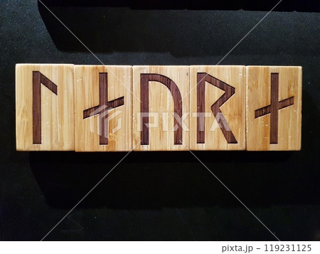 Laura written in runic characters engraved on wooden tablets. 119231125
