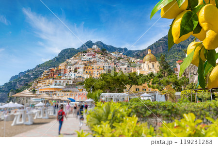Beautiful Positano with comfortable beaches on Amalfi Coast in Campania, Italy. Ripe yellow lemons in foreground. 119231288