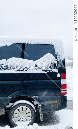 snow on the car glass in the form of mountains 119232046