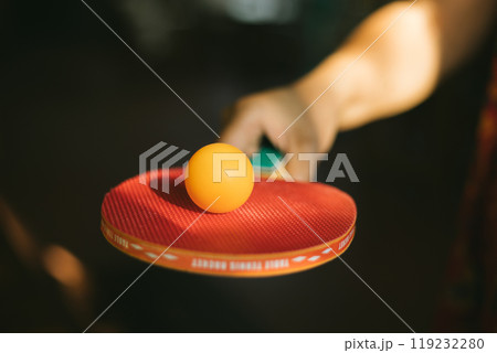 Two ping pong rackets on table 119232280