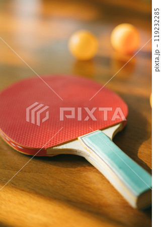 Two ping pong rackets on table 119232285