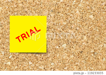 Yellow note paper with word trial on cork board background with copy space Yellow note paper with word trial on cork board background with copy space 119233035
