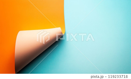 Orange paper corner curl revealing pastel blue background Orange paper corner curl revealing pastel blue background 119233718