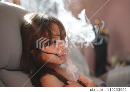 Girl portrait of using nebuliser 119233962
