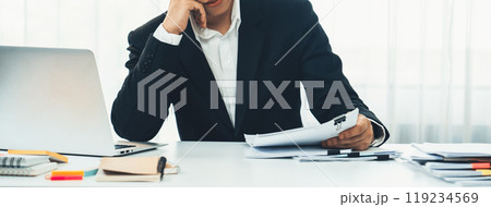Corporate accountant use calculator to calculate financial report. Shrewd Corporate accountant use calculator to calculate financial report. Shrewd 119234569