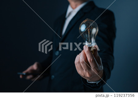 innovation technology success business. person hand holding power lightbulb and pretend to think, inspiration, creativity and imagination concept, Digital transformation. 119237356