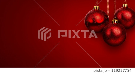 Three red Christmas ornaments hang against a red background. Three red Christmas ornaments hang against a red background. 119237754