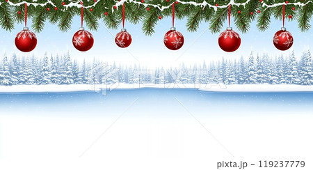 Red ornaments hang from a snowy pine branch over a wintery forest scene. 119237779