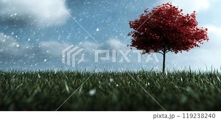 A single red tree stands tall in a field of green grass as snow falls softly. 119238240