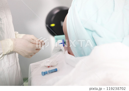 Injections of spinal anesthesia. Injections of epidural anesthesia in preparation for vascular surgery.Close-up. Concept of healthcare and medicine. Injections of spinal anesthesia. Injections of epidural anesthesia in preparation for vascular surgery.Close-up. Concept of healthcare and medicine. 119238702