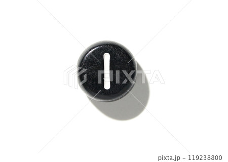 Close-up of black keyboard key with white vertical line on simple white 119238800