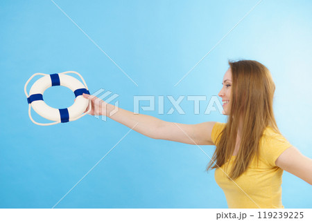 Girl holds life buoy rescue ring Girl holds life buoy rescue ring 119239225