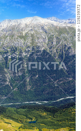 View of a small river with a waterfall flowing 119239372